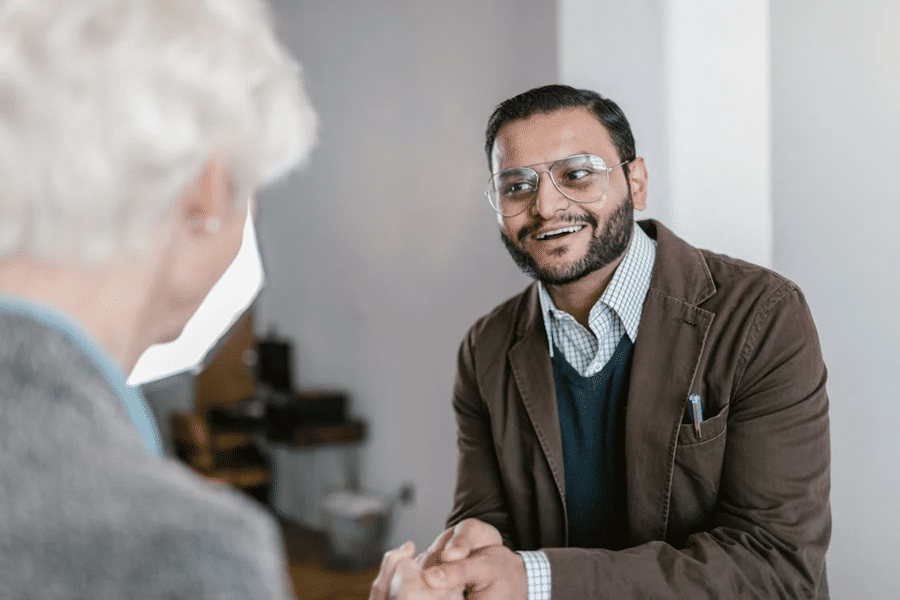 Two people in discussion, focusing on international estate planning for cross-border families.