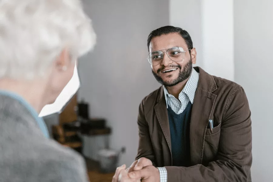 Two people in discussion, focusing on international estate planning for cross-border families.